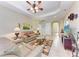 Bright and airy living room with tile floors, comfortable seating, and ample lighting at 12851 24Th Street E Cir, Parrish, FL 34219