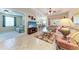 Spacious living area with neutral tones, tile flooring, and views of the outdoor space at 12851 24Th Street E Cir, Parrish, FL 34219