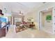 Open living room with tile floors, comfortable seating, and access to the lanai at 12851 24Th Street E Cir, Parrish, FL 34219