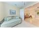 Bedroom with a daybed opening up into a beautiful living room space at 12851 24Th Street E Cir, Parrish, FL 34219