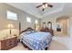 Spacious main bedroom with tray ceiling, and walk-in closet access at 12851 24Th Street E Cir, Parrish, FL 34219