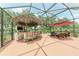 This backyard has an outdoor kitchen, bar, grill, and a lounge area perfect for entertaining at 12851 24Th Street E Cir, Parrish, FL 34219