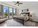 Spacious main bedroom featuring large windows, a sitting area, and stylish decor at 16419 Paynes Mill Dr, Bradenton, FL 34211