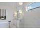 A bright bathroom showcasing a glass shower, free standing tub, and marble vanity at 16511 Cornwall Ln, Lakewood Ranch, FL 34202