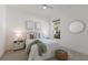 Bright and airy bedroom with a comfortable queen-size bed, soft lighting, and ample natural light at 16511 Cornwall Ln, Lakewood Ranch, FL 34202