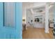 Bright entryway featuring hardwood floors and an open concept design into the living room at 16511 Cornwall Ln, Lakewood Ranch, FL 34202