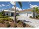 Charming single-Gathering home featuring lush landscaping and a spacious three car driveway at 16511 Cornwall Ln, Lakewood Ranch, FL 34202