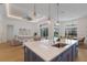 Bright, open kitchen with island seating overlooking the living and dining areas at 16511 Cornwall Ln, Lakewood Ranch, FL 34202
