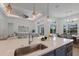 Bright, open kitchen island with sink overlooking the living areas at 16511 Cornwall Ln, Lakewood Ranch, FL 34202