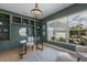 Stylish home office with built-in shelves, a modern desk, and large windows at 16511 Cornwall Ln, Lakewood Ranch, FL 34202