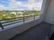 A comfortable balcony with views of the canal and neighborhood at 1709 N Tamiami Trail # Ph 514, Sarasota, FL 34234