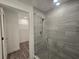This bathroom features a glass enclosed shower and attached walk-in closet at 1709 N Tamiami Trail # Ph 514, Sarasota, FL 34234