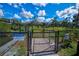 Community dog walk with a secure fence and a sign indicating it's for residents and guests only at 1709 N Tamiami Trail # Ph 514, Sarasota, FL 34234