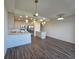 Contemporary kitchen and dining area with modern light fixtures at 1709 N Tamiami Trail # Ph 514, Sarasota, FL 34234