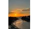 Beautiful waterfront view with an orange sunset, perfect for a peaceful evening at 1709 N Tamiami Trail # Ph 514, Sarasota, FL 34234