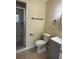 Clean bathroom with tiled shower, modern vanity, and dark towel rack and ring at 201 Elliot Ave, Sarasota, FL 34232
