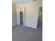 Neutral bedroom featuring new carpet and a bi-fold closet door at 201 Elliot Ave, Sarasota, FL 34232