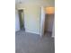 Comfortable bedroom featuring neutral paint, new carpet and a bi-fold closet at 201 Elliot Ave, Sarasota, FL 34232