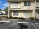 Charming townhouse featuring tidy landscaping and reserved guest parking at 201 Elliot Ave, Sarasota, FL 34232