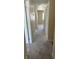 View down a hallway with carpet and many doors at 201 Elliot Ave, Sarasota, FL 34232