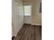 View of a hallway to a door with closet and utility access at 201 Elliot Ave, Sarasota, FL 34232