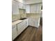 Bright kitchen featuring stainless appliances, stylish cabinets and granite countertops at 201 Elliot Ave, Sarasota, FL 34232