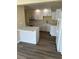 Charming kitchen boasts white cabinets, modern appliances, and stylish countertops at 201 Elliot Ave, Sarasota, FL 34232