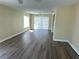Inviting living room with lots of light and stylish, modern flooring at 201 Elliot Ave, Sarasota, FL 34232