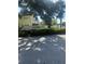 Sign for Fairway Oaks with lush landscaping at 201 Elliot Ave, Sarasota, FL 34232