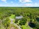 Stunning aerial view of a beautiful property surrounded by lush greenery and serene bodies of water at 21705 67Th E Ave, Bradenton, FL 34211