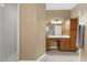 Bright bathroom featuring a shower, vanity, and ample counter space and cabinet space at 21705 67Th E Ave, Bradenton, FL 34211