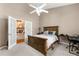Comfortable bedroom with a doorway to another room and featuring a work space at 21705 67Th E Ave, Bradenton, FL 34211