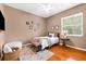 Bright bedroom with hardwood floors, decorative wall art, and a comfortable sleeping space at 21705 67Th E Ave, Bradenton, FL 34211