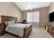 Comfortable bedroom with a ceiling fan, desk and window views at 21705 67Th E Ave, Bradenton, FL 34211