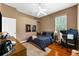 Nicely appointed bedroom featuring ample natural light with hardwood flooring and ceiling fan at 21705 67Th E Ave, Bradenton, FL 34211