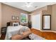 Bedroom with hardwood floors, closet, and a cozy interior design with ample natural light at 21705 67Th E Ave, Bradenton, FL 34211