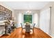 Cozy dining area with hardwood floors, decorative lighting, and large windows offering outdoor views at 21705 67Th E Ave, Bradenton, FL 34211