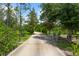Private driveway leads through a picturesque landscape, offering a sense of seclusion at 21705 67Th E Ave, Bradenton, FL 34211