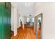 Inviting home foyer with hardwood floors that leads into the well-lit living space at 21705 67Th E Ave, Bradenton, FL 34211
