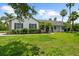 Beautiful single-story home with lush front lawn, charming shutters, and inviting front entrance at 21705 67Th E Ave, Bradenton, FL 34211