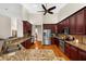 Spacious kitchen with granite countertops, wood floors and stainless steel appliances at 21705 67Th E Ave, Bradenton, FL 34211