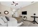 Comfortable main bedroom with sitting area, carpet flooring, and lots of natural light at 21705 67Th E Ave, Bradenton, FL 34211