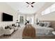 Bright main bedroom with sitting area, access to the pool, and carpet flooring at 21705 67Th E Ave, Bradenton, FL 34211
