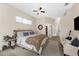 Comfortable main bedroom with sitting area, carpet flooring, and lots of natural light at 21705 67Th E Ave, Bradenton, FL 34211