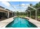 A beautiful pool is surrounded by a screened-in patio and offers stunning views at 21705 67Th E Ave, Bradenton, FL 34211