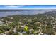 Expansive aerial shot shows a house near a wide expanse of water, emphasizing its connection to nature and waterfront lifestyle at 218 32Nd W St, Bradenton, FL 34205