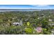 Beautiful aerial of the house surrounded by lush greenery, located near the water for a serene living experience at 218 32Nd W St, Bradenton, FL 34205