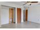 Bright bedroom features spacious closets, neutral walls, and ceiling fan, ready for customization at 218 32Nd W St, Bradenton, FL 34205