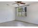 Sunny bedroom with ceiling fan, white walls and large window, perfect for relaxation at 218 32Nd W St, Bradenton, FL 34205