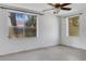 Bright bedroom featuring white walls, large windows, and modern ceiling fan at 218 32Nd W St, Bradenton, FL 34205